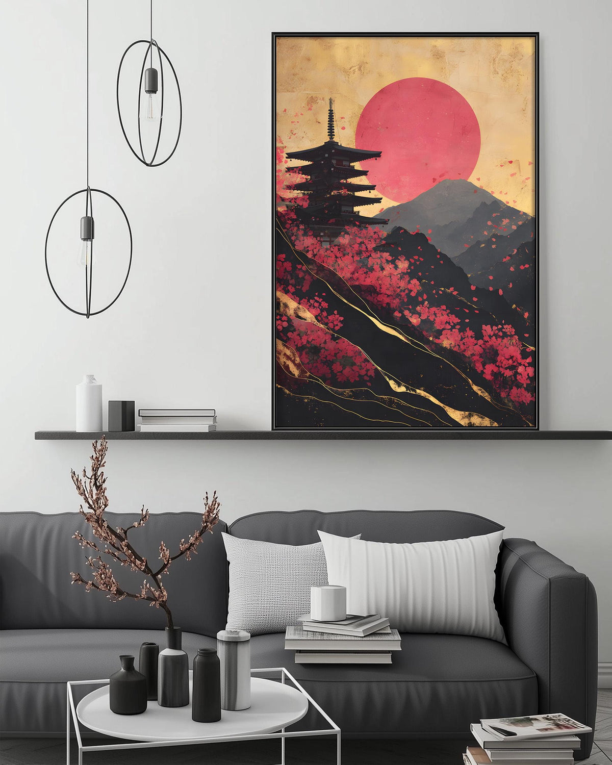 a modern living room with a gray sofa, a coffee table, and a large framed artwork depicting a temple and a red sun on a mountain.