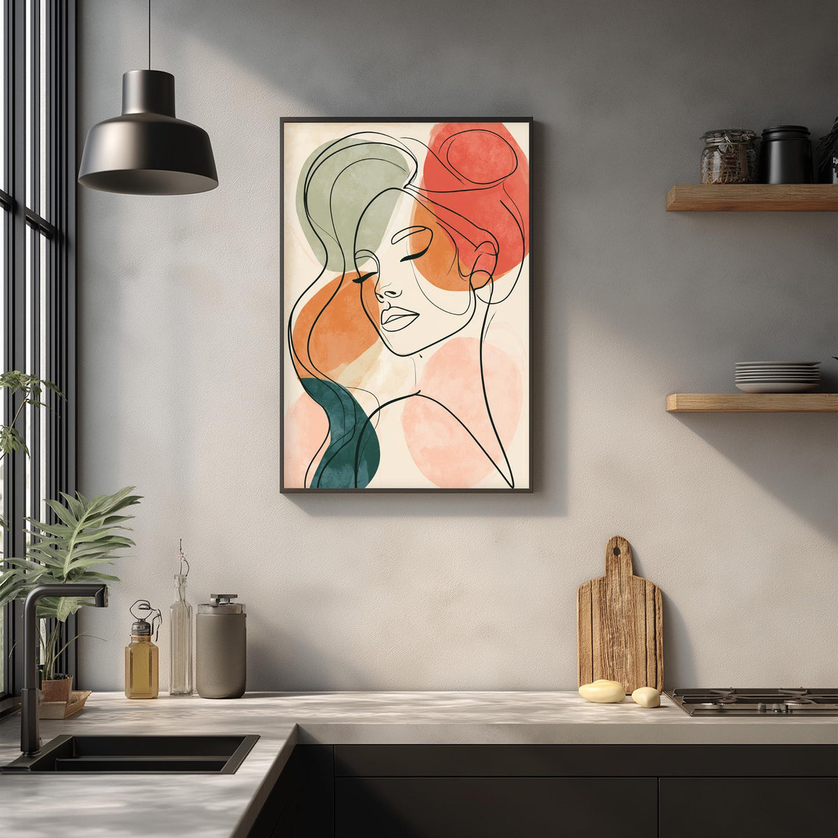 a modern kitchen with a framed abstract portrait of a woman's face hanging on the wall above a countertop with various kitchen items.