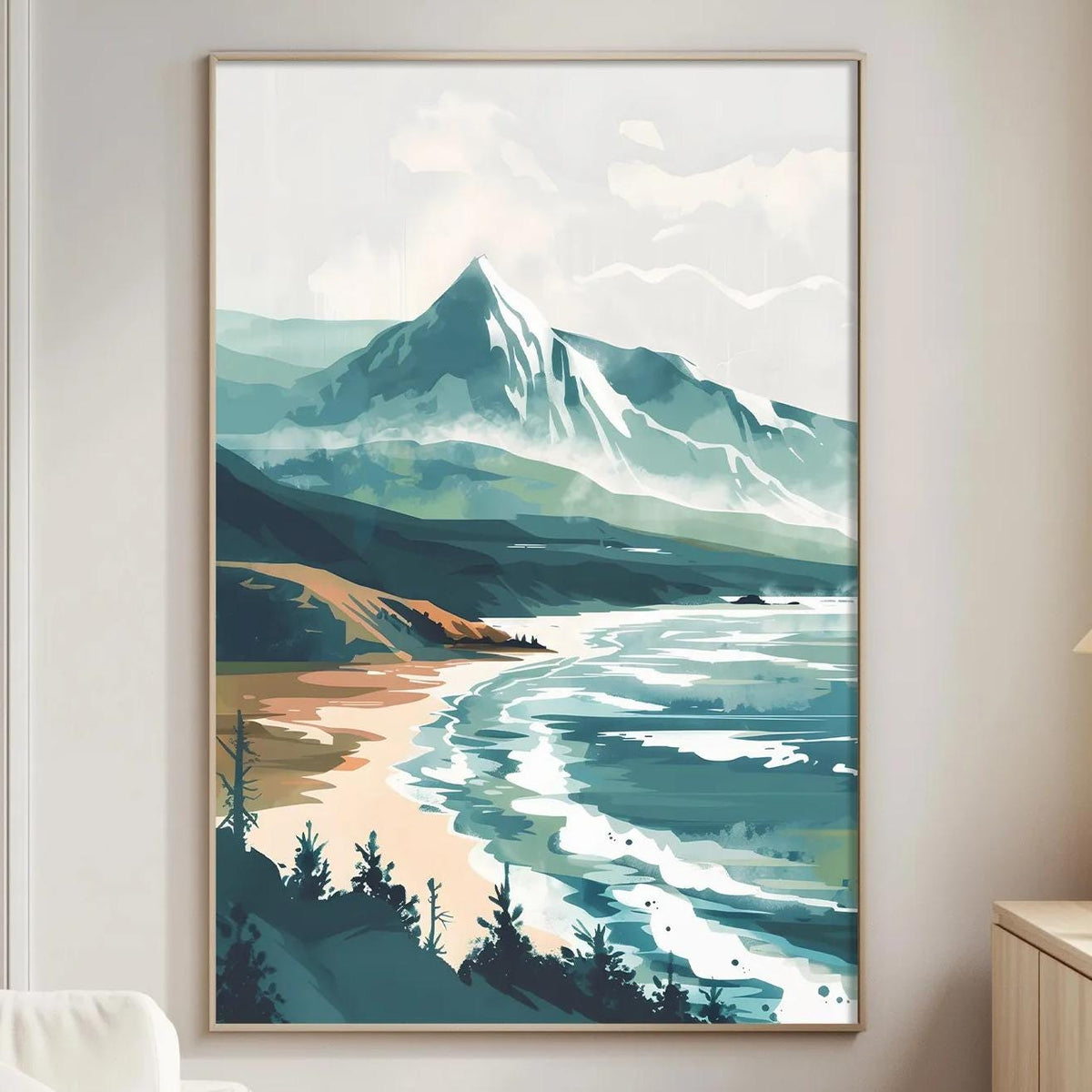 a large landscape painting hanging on a wall in a living room, depicting a serene mountain scene with a beach and ocean in the background.