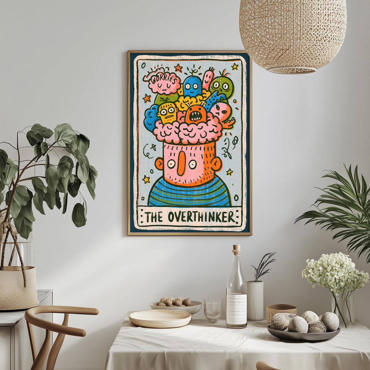 a colorful and whimsical poster of a character named "The Overthinker" hanging on a wall above a dining table. The table is set with various items, including a bottle, a bowl, and a vase, creating a cozy and inviting atmosphere.