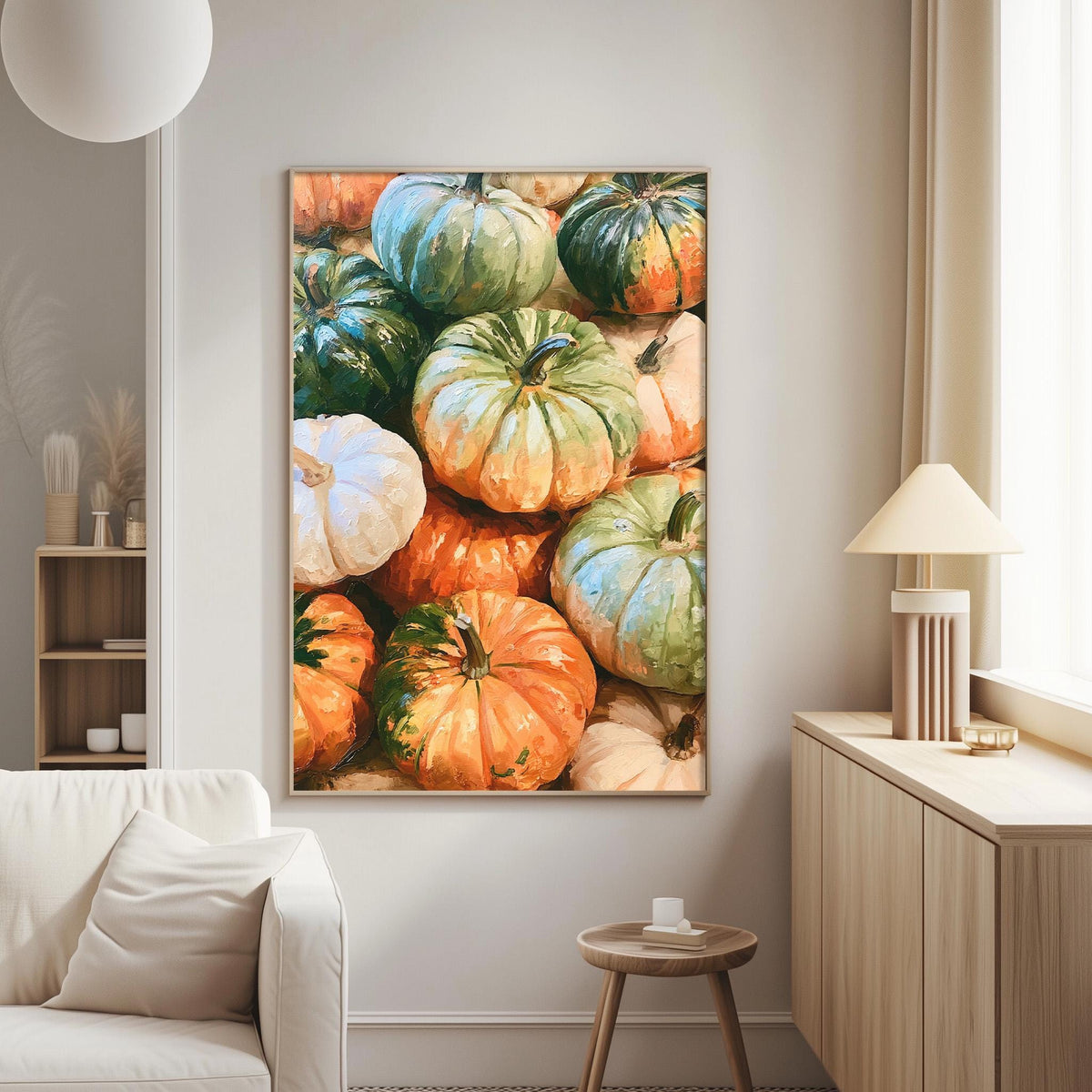 a large framed painting of pumpkins hanging on a wall in a living room.