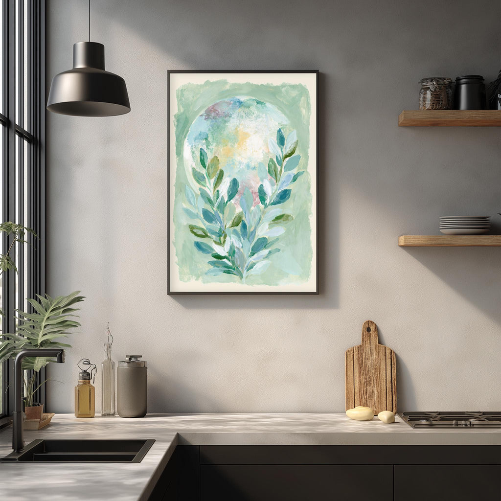 a kitchen counter with a framed painting of a plant hanging above it. The painting has a green and blue color scheme, and it appears to be a watercolor piece. The kitchen counter also has various items such as a cutting board, a bottle, and a vase.