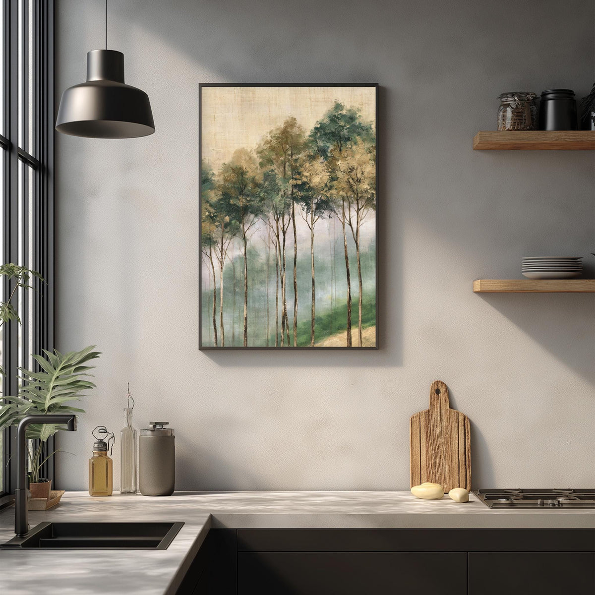 a kitchen counter with a framed painting of trees hanging above it, a wooden cutting board, and various kitchen items such as a bottle, a vase, and a bowl.