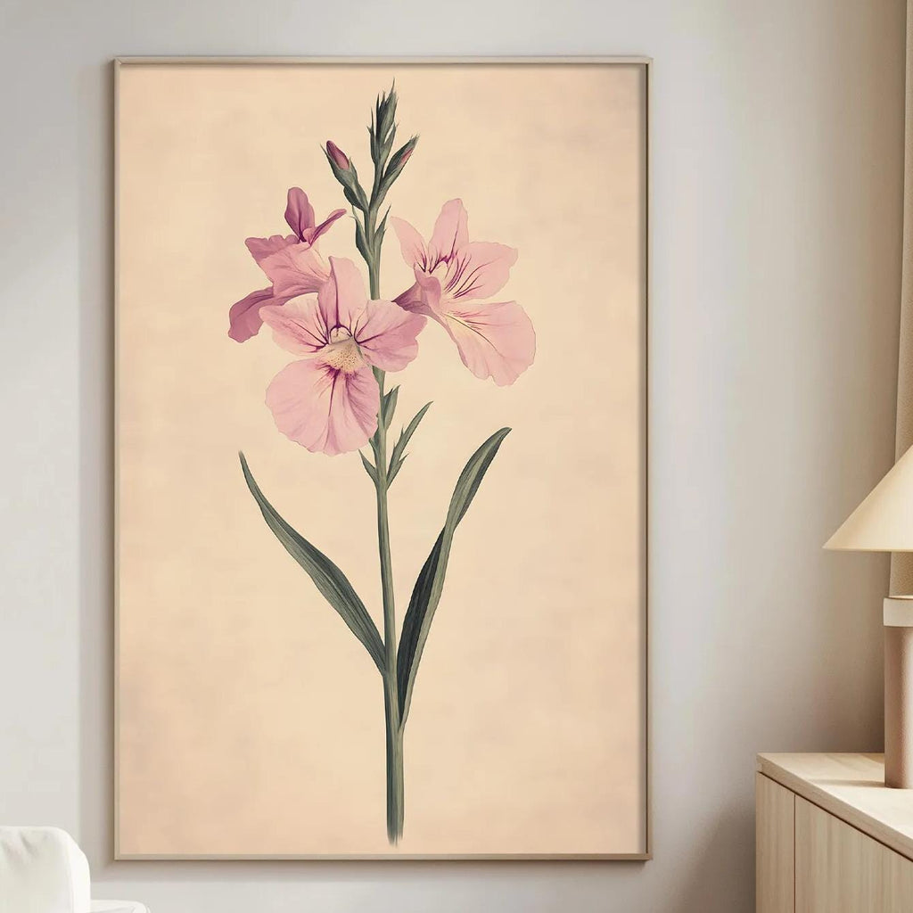 a living room with a large framed print of a pink flower on the wall, a white sofa, a wooden side table, and a lamp.