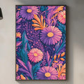 a kitchen counter with a framed poster of a vibrant floral pattern hanging above it. The poster has a mix of purple, orange, and green colors, creating a lively and colorful atmosphere. The kitchen counter also has various items such as a cutting board, a soap dispenser, and a bottle, adding to the overall aesthetic of the space.