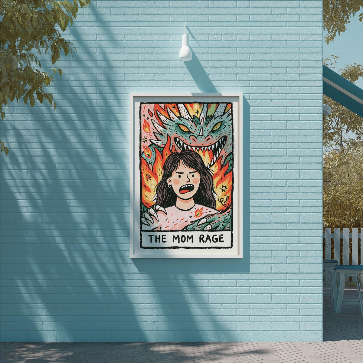 a poster with a woman's face and a dragon, with the text "THE MOM RAGE" below the illustration.