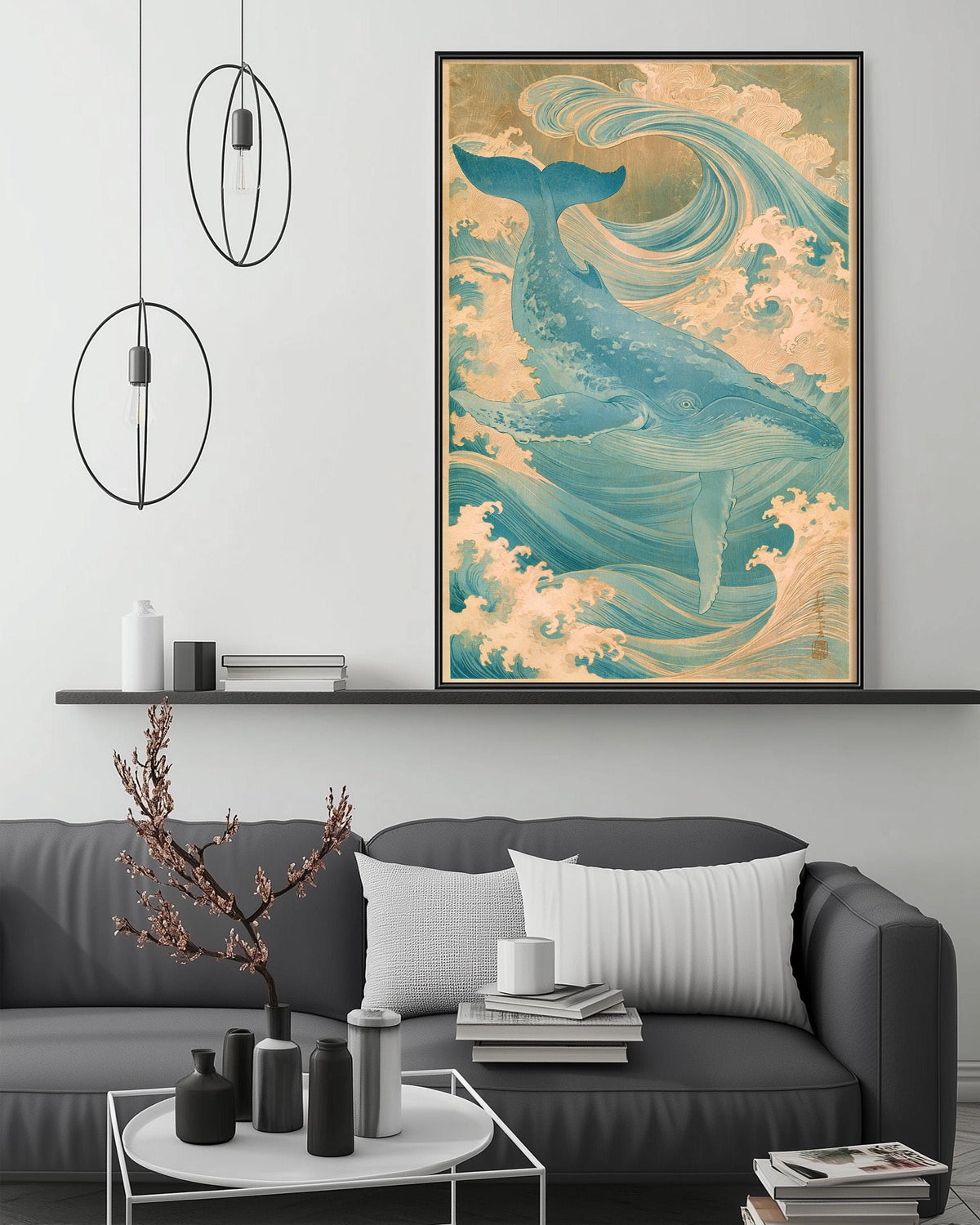 a large, colorful painting of a whale on the wall above a gray couch in a living room setting.