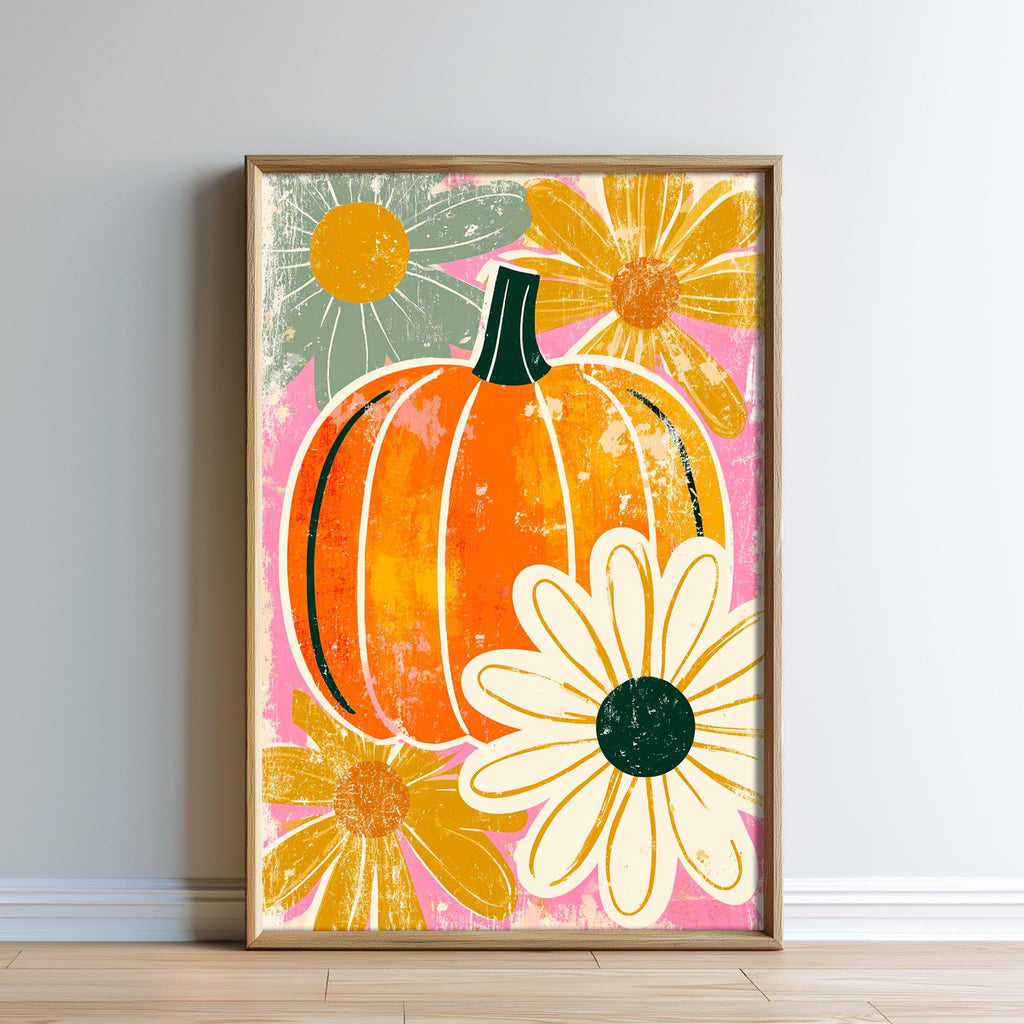 The image is a framed print featuring a vibrant illustration of a pumpkin surrounded by colorful flowers, including a daisy and a sunflower, against a pink and green background.