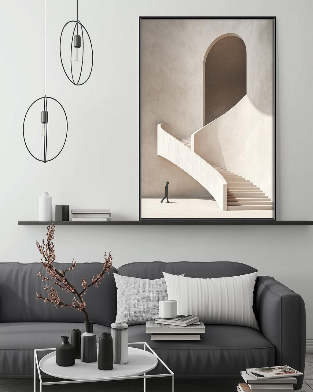 a modern living room with a gray sofa, a coffee table, and a large framed artwork depicting a person walking up a curved staircase.