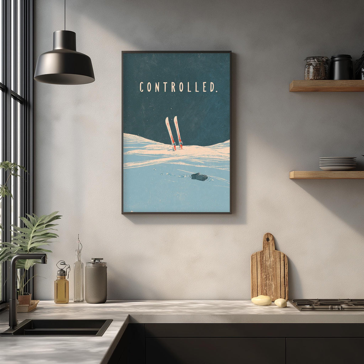 a kitchen counter with various kitchen items, including a cutting board, a bottle, and a plant. Above the counter, there is a framed poster with the word "controlled" written on it.