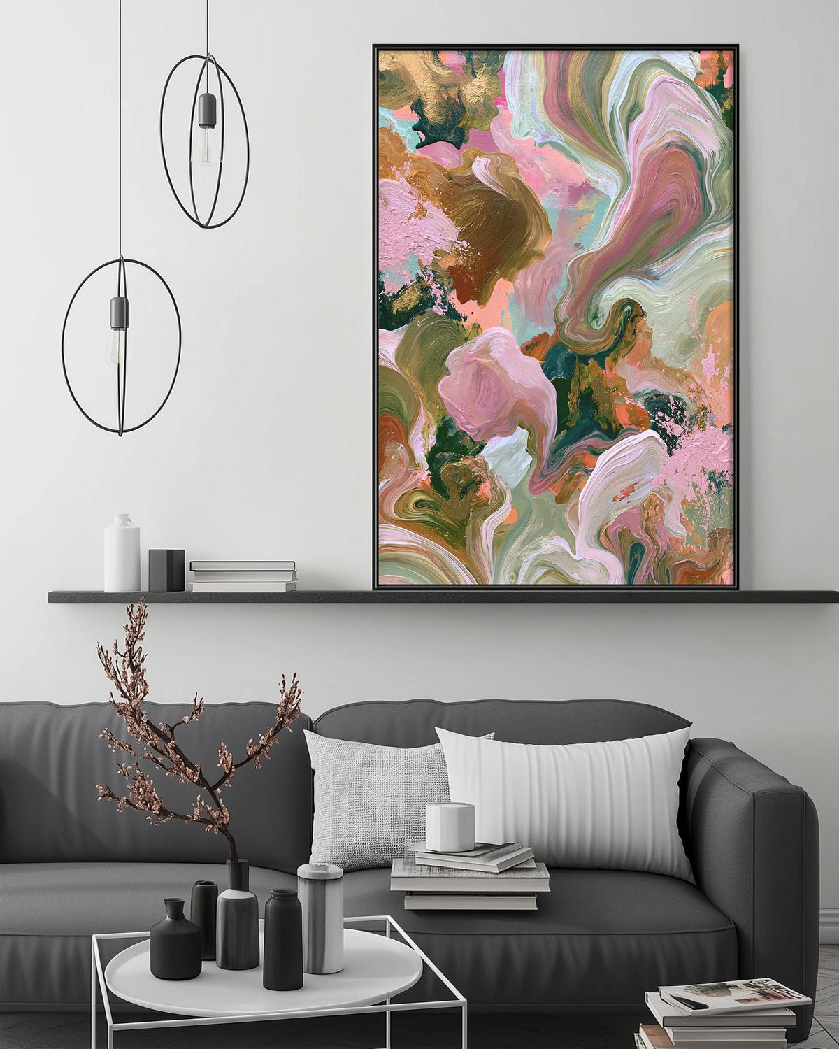 a modern living room with a gray sofa, a coffee table, and a large abstract painting hanging on the wall above the sofa.