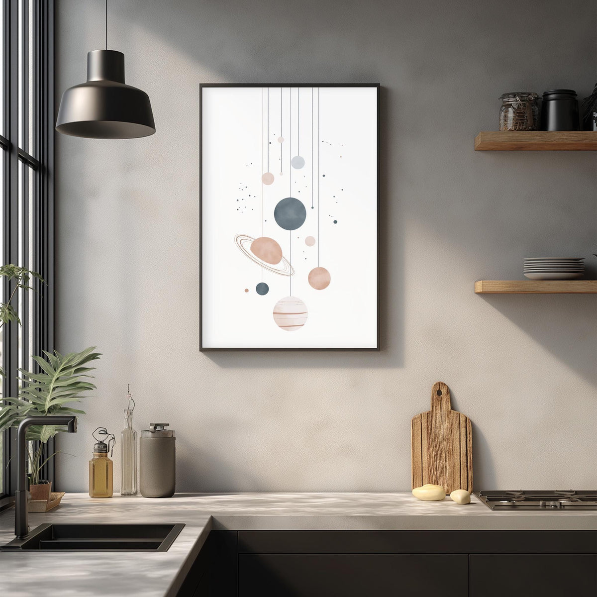 a modern kitchen with a minimalist design. The focal point is a framed artwork depicting planets hanging from strings, creating a celestial atmosphere. The kitchen counter is adorned with various kitchen items, including a cutting board, a bottle, and a vase. The overall color scheme is neutral, with shades of gray and white, creating a calm and serene ambiance.