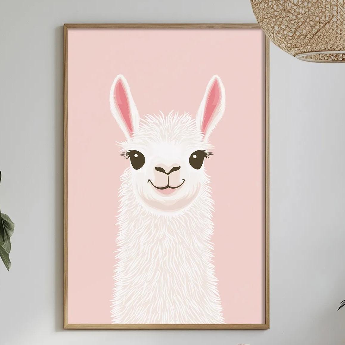 a pink wall with a framed picture of a smiling llama, a potted plant, a table with a vase of flowers, and a hanging light fixture.