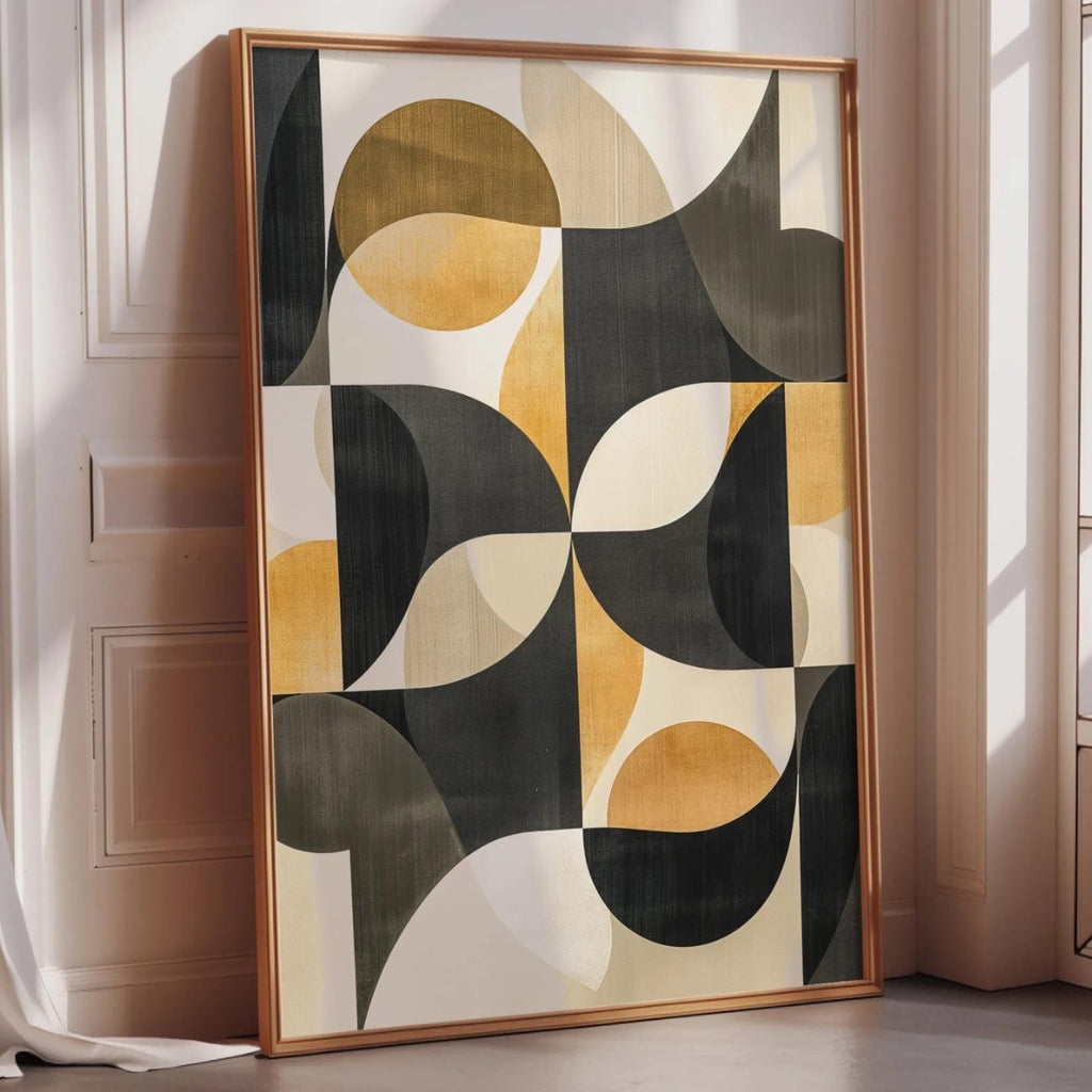 a large abstract painting with a geometric design in black, yellow, and white colors. The painting is displayed on a white wall, and it is leaning against the wall.