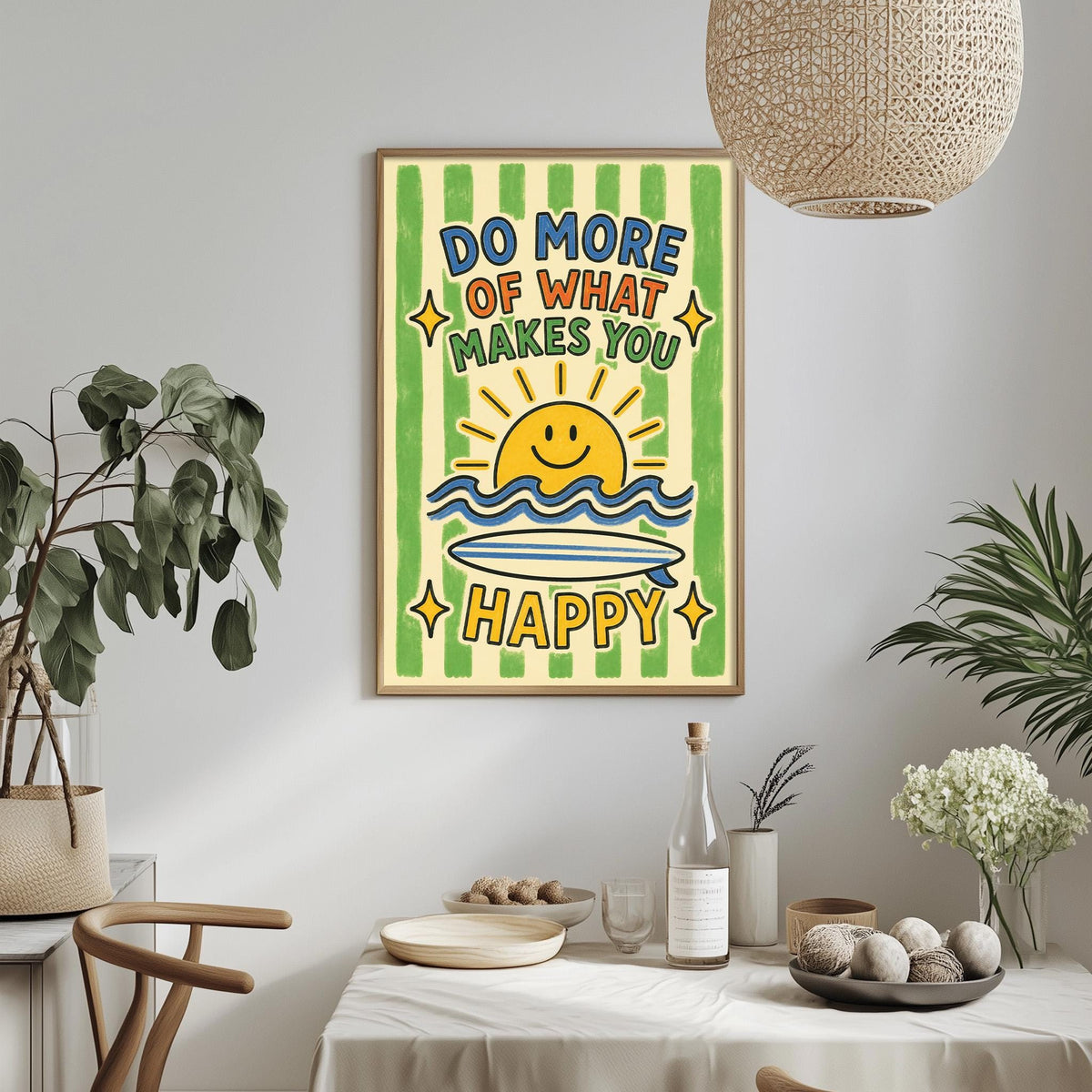 a framed poster with a cheerful message, hanging on a wall above a dining table with various items on it.