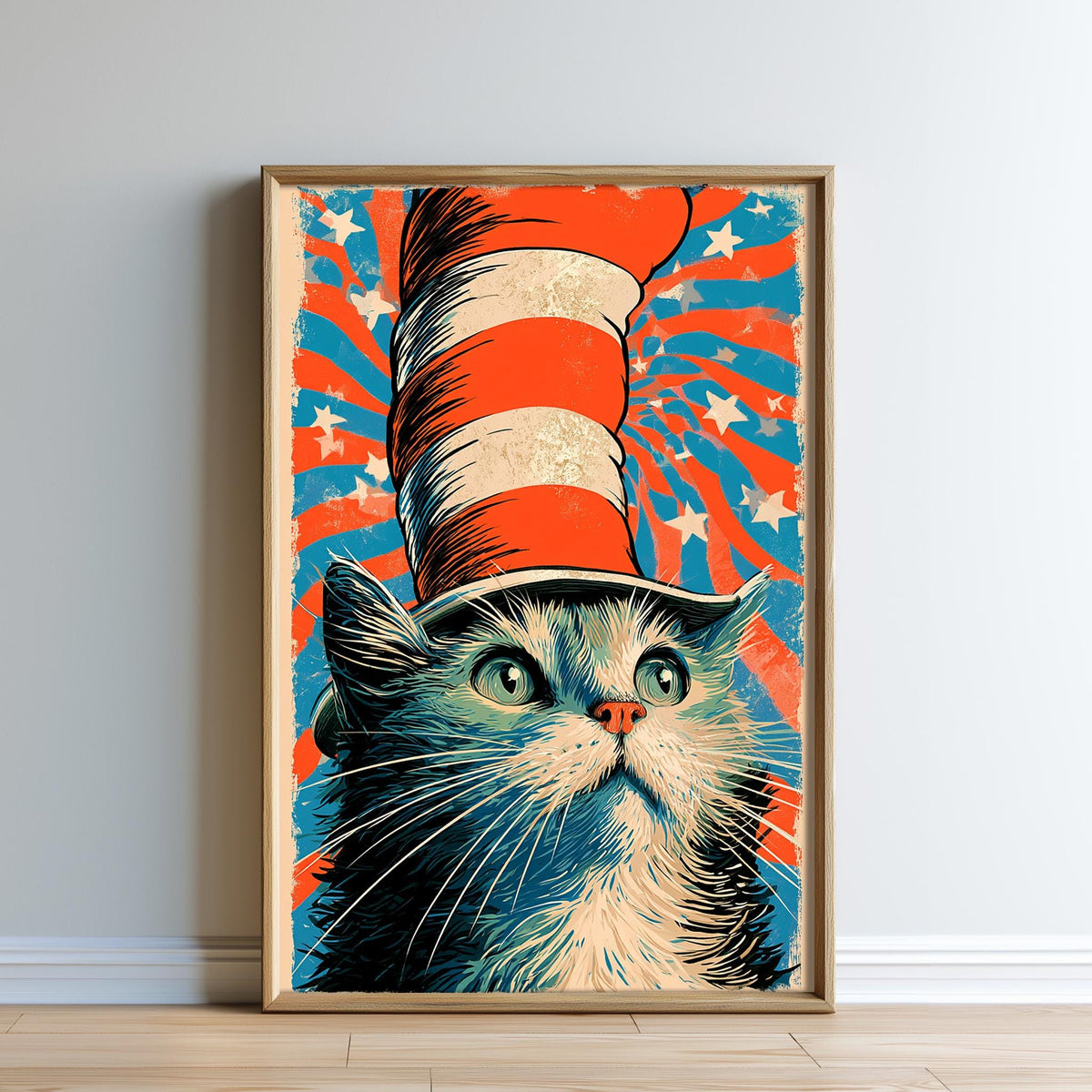 A framed illustration of a cat wearing a red, white, and blue striped hat, with a starry background.
