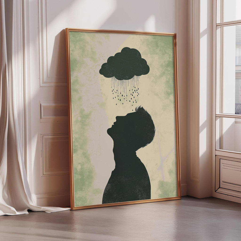 a framed artwork depicting a silhouette of a person's head and shoulders, with a cloud of rain falling from above.