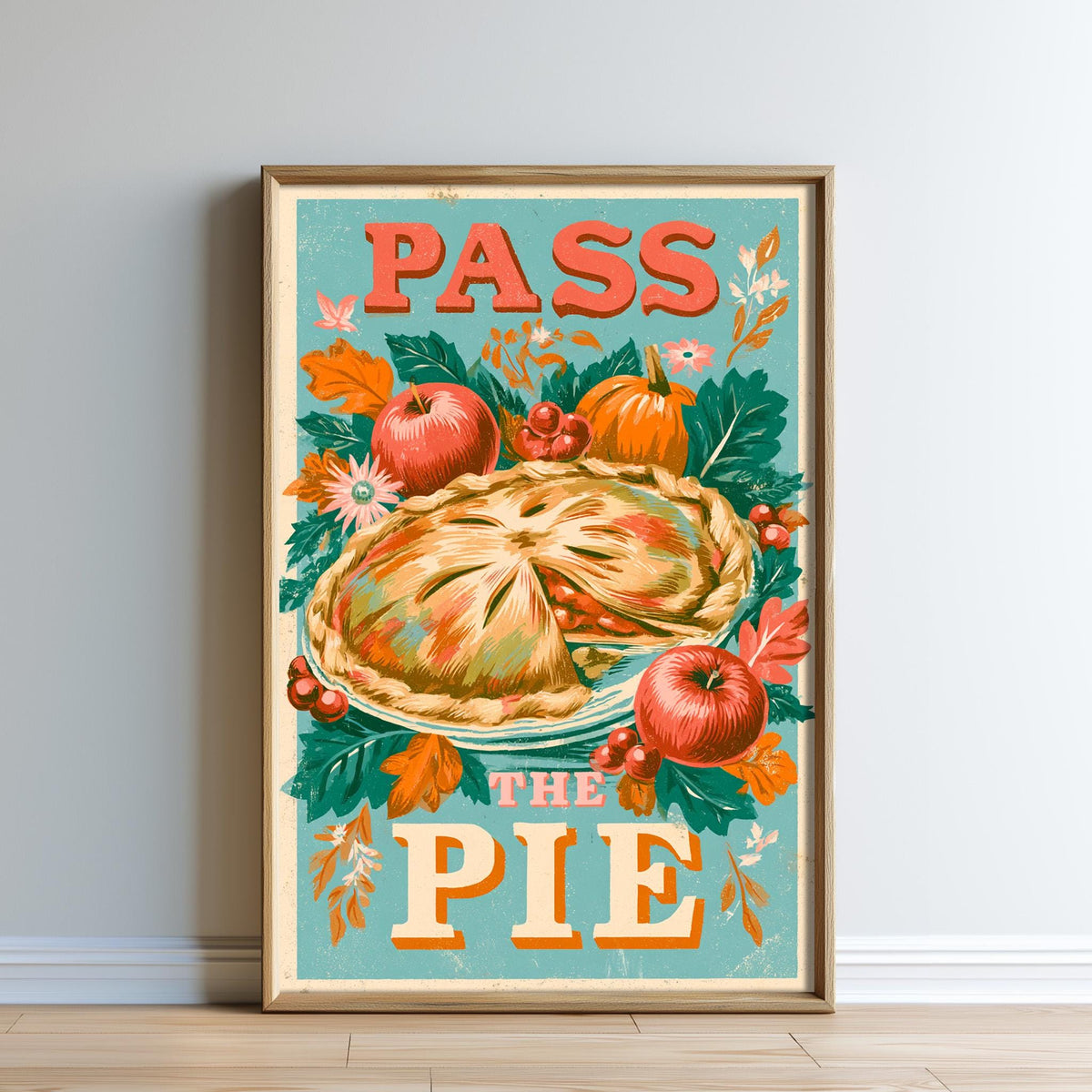 The image is a framed poster with a vibrant illustration of a pie surrounded by autumn leaves, berries, and other seasonal elements. The text on the poster reads "PASS THE PIE".