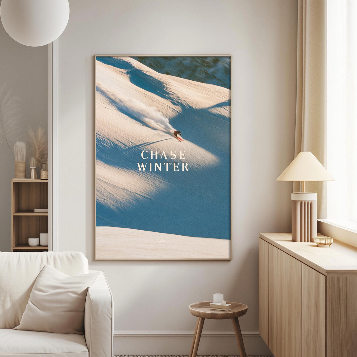 a large framed poster of a snowboarder on a snowy mountain, with the text "CHASE WINTER" prominently displayed.