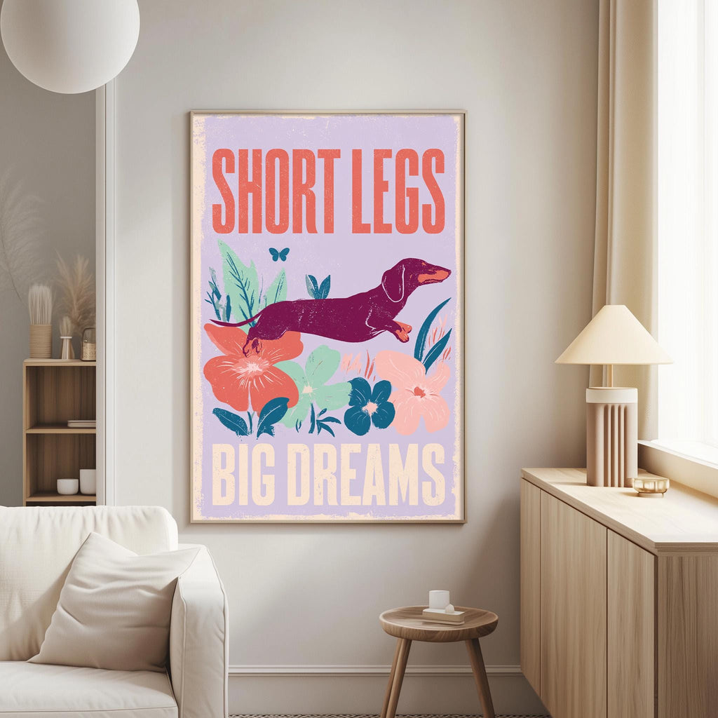 a poster with a dog and flowers on a wall, along with the text "SHORT LEGS BIG DREAMS" displayed prominently.