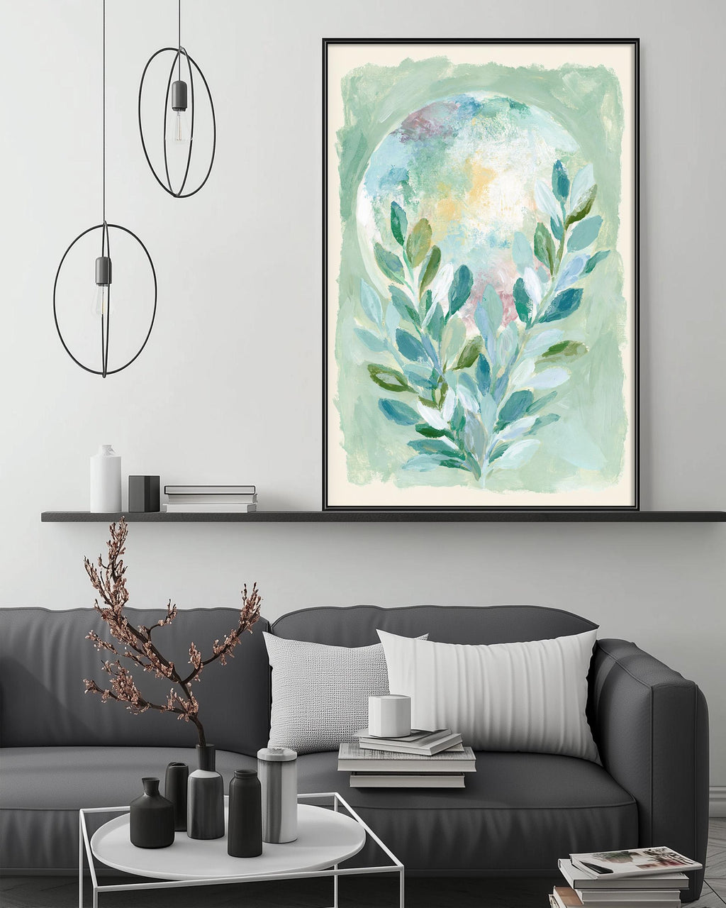a modern living room with a gray sofa, a coffee table, and a large painting of a plant on the wall above the sofa.