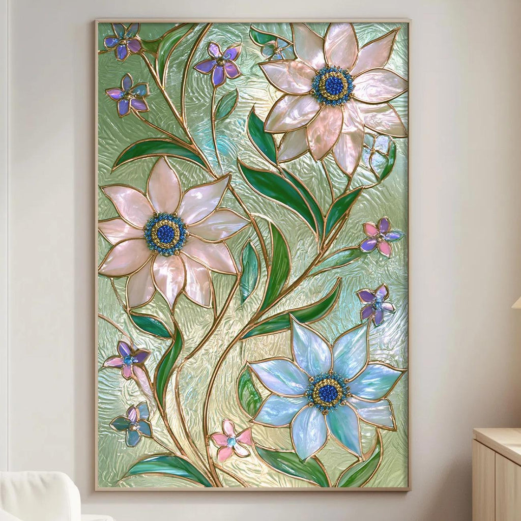 a large, colorful stained glass artwork hanging on a wall in a living room. The artwork displays a variety of flowers and leaves in shades of pink, blue, and green, creating a vibrant and lively atmosphere. The room is furnished with a white sofa and a wooden side table, contributing to the overall cozy and inviting ambiance.