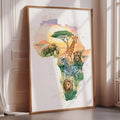 The image is a framed artwork depicting various African animals, including elephants, giraffes, zebras, and lions, arranged in the shape of the African continent.