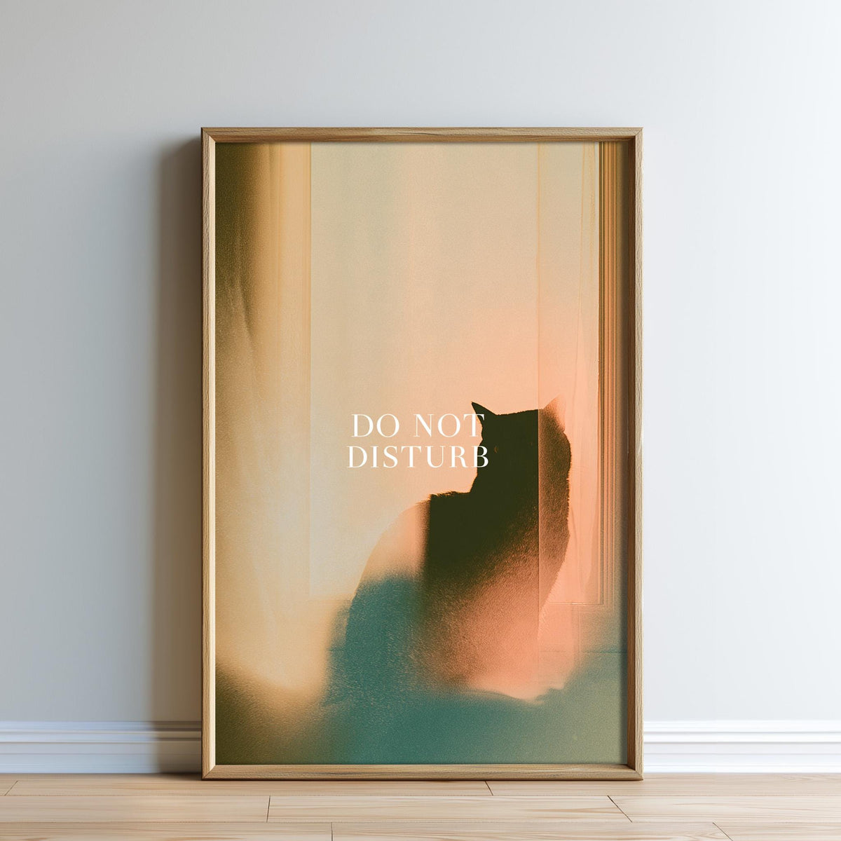 a framed poster with a silhouette of a cat and the text "DO NOT DISTURB" displayed prominently.