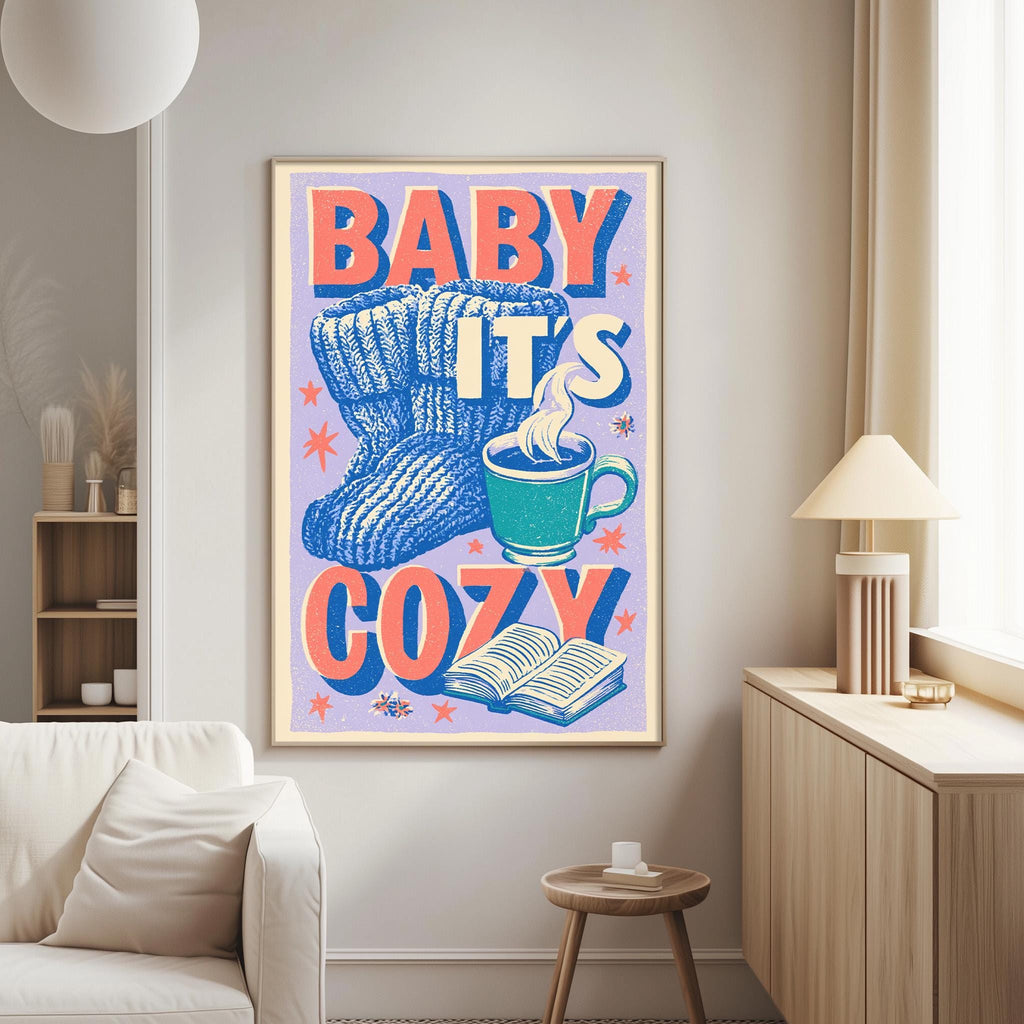 a cozy and warm atmosphere with a framed poster on the wall that reads "BABY IT'S COZY".