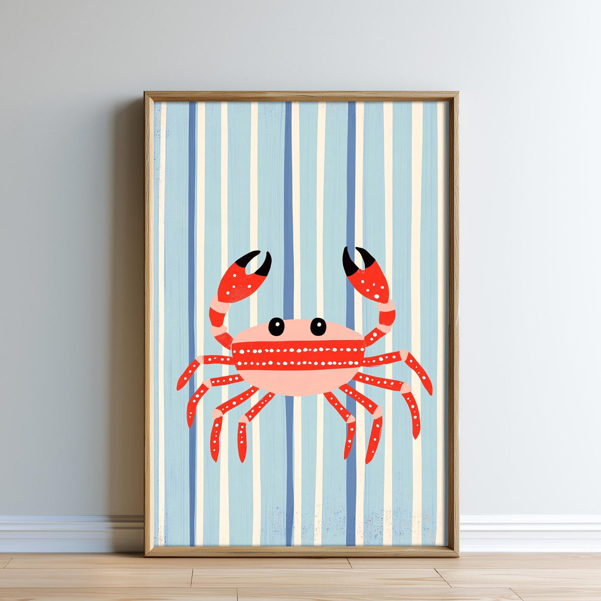 A framed print of a red crab with large claws and a pink body, set against a striped blue background.