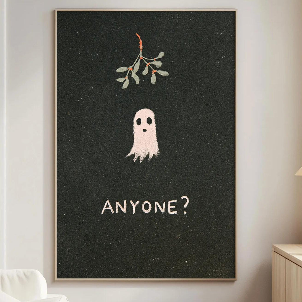 a living room with a white couch, a wooden side table, and a framed poster on the wall. The poster has a ghost and the text "ANYONE?" written on it.