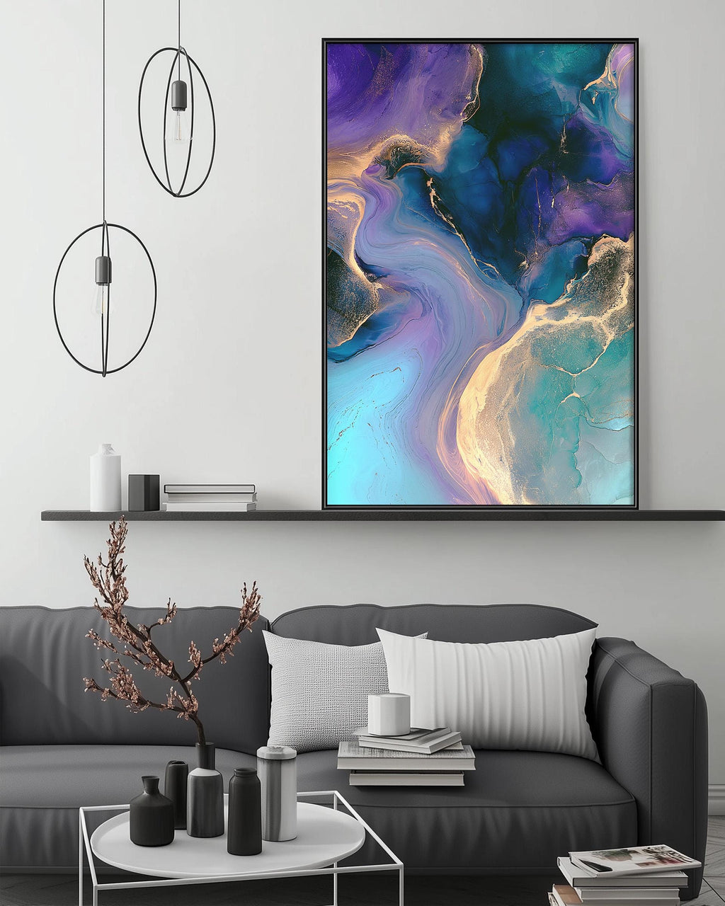 a modern living room with a gray sofa, a coffee table, and a large abstract painting hanging on the wall above the sofa.