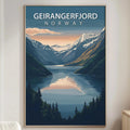a large poster of a scenic mountain landscape with a lake in the foreground, hanging on a wall in a living room.