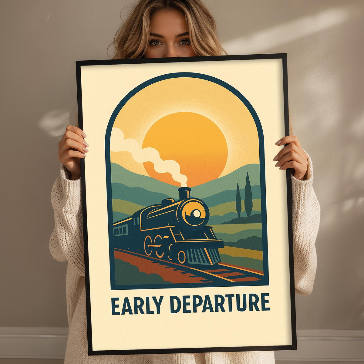 A woman is holding up a framed poster with a vintage-style illustration of a train on the tracks, depicting the phrase "Early Departure".