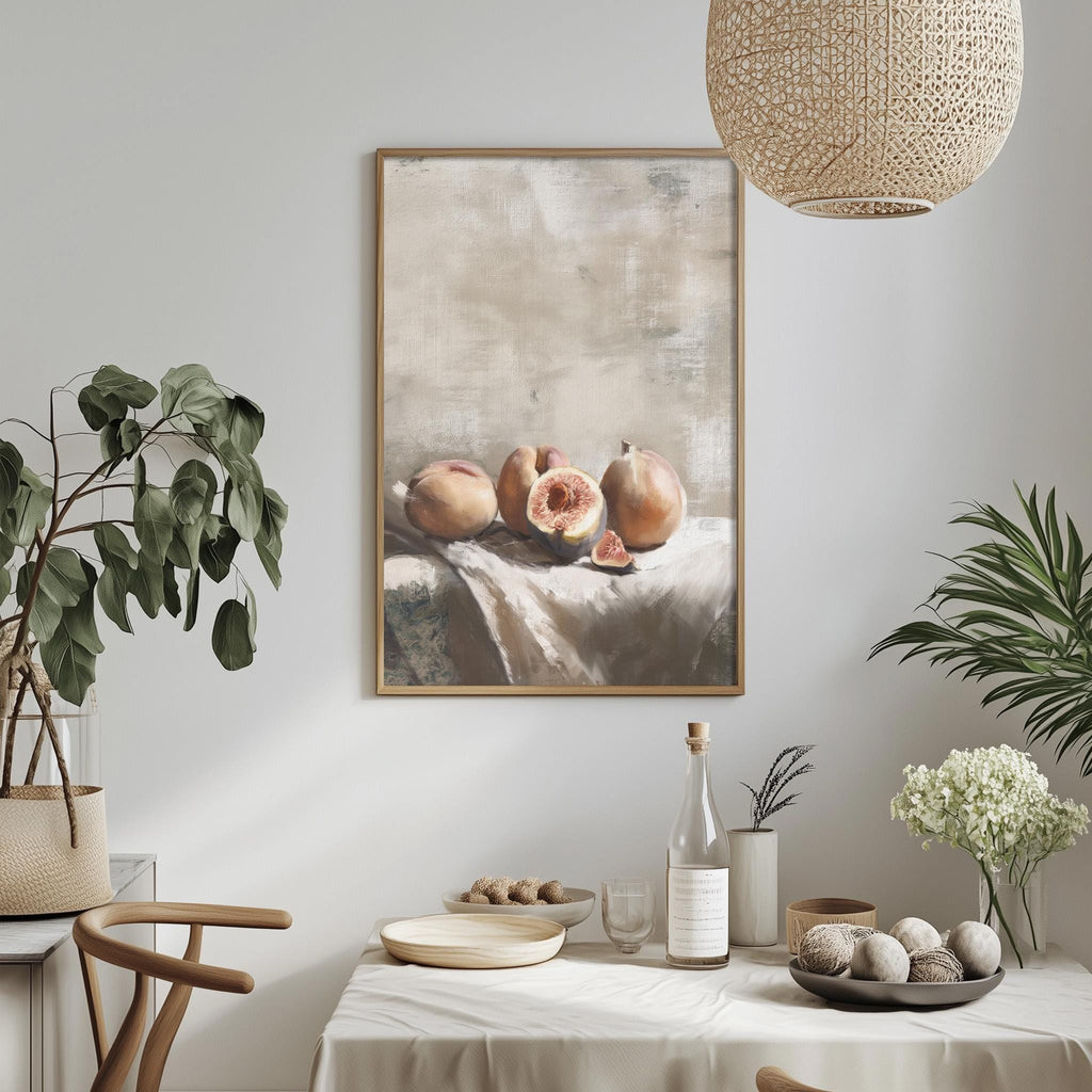 a dining table set with a white tablecloth, a bowl of fruit, a bottle, and a vase with flowers. A framed painting of fruit is hanging on the wall above the table.