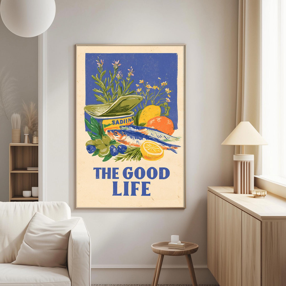 a poster with a vibrant illustration of various fruits and vegetables, including a can of Sadiol, a lemon, and an orange, along with the text "The good life".