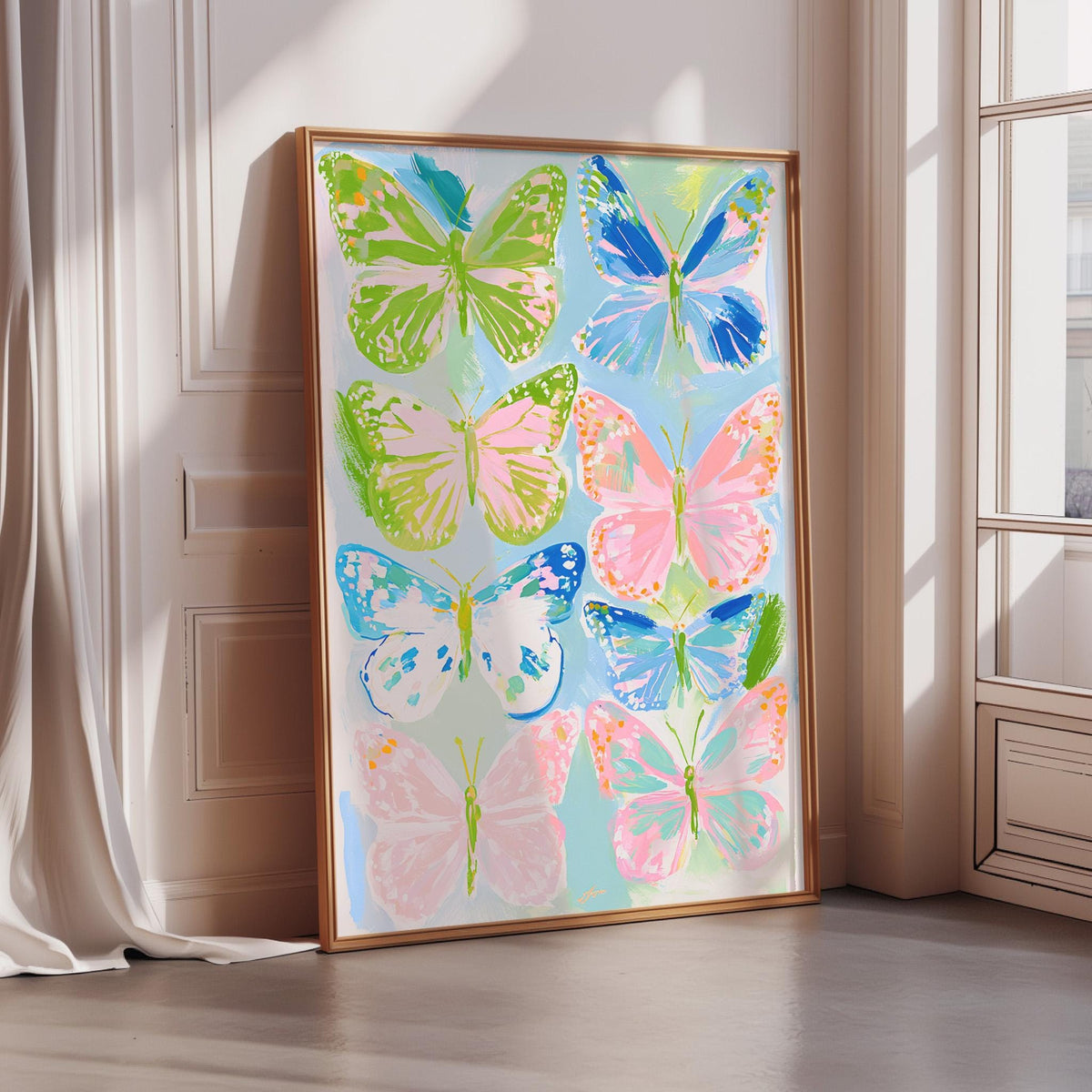 A large framed poster featuring a vibrant display of colorful butterflies in various shades of green, pink, blue, and white.