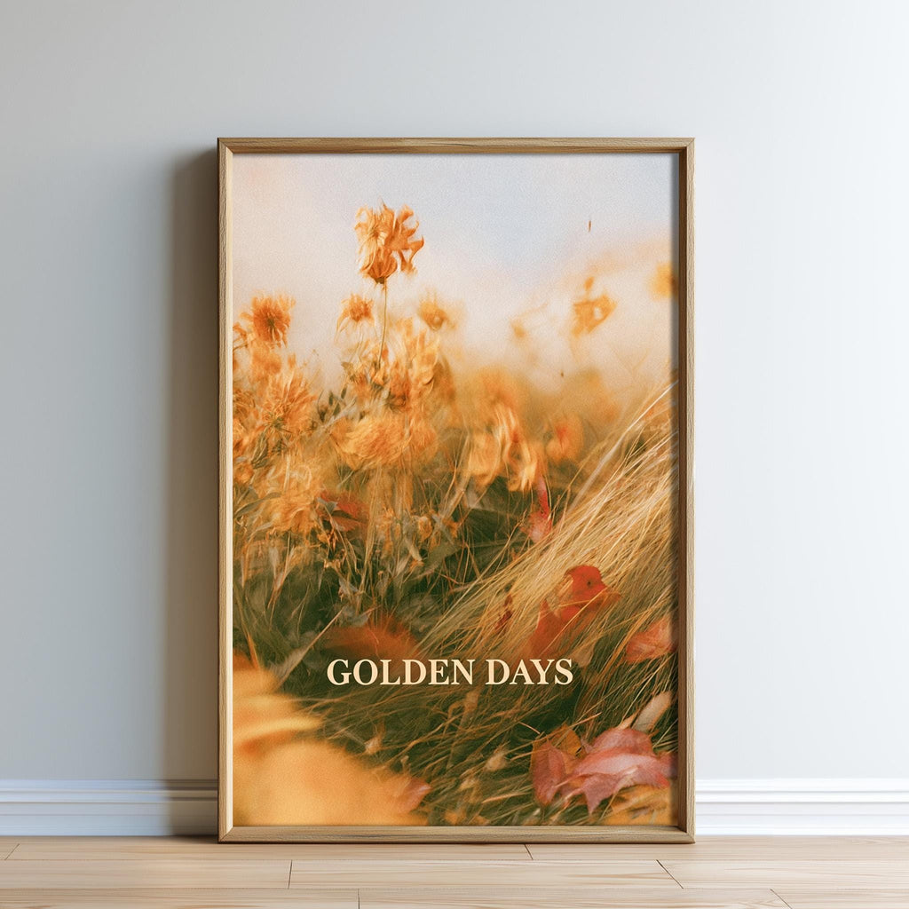 The image is a framed print of a field of flowers with the text "GOLDEN DAYS" displayed on the bottom.