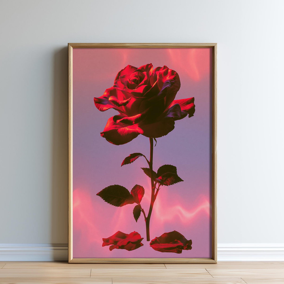 A framed image of a large, vibrant red rose against a pink and purple background.