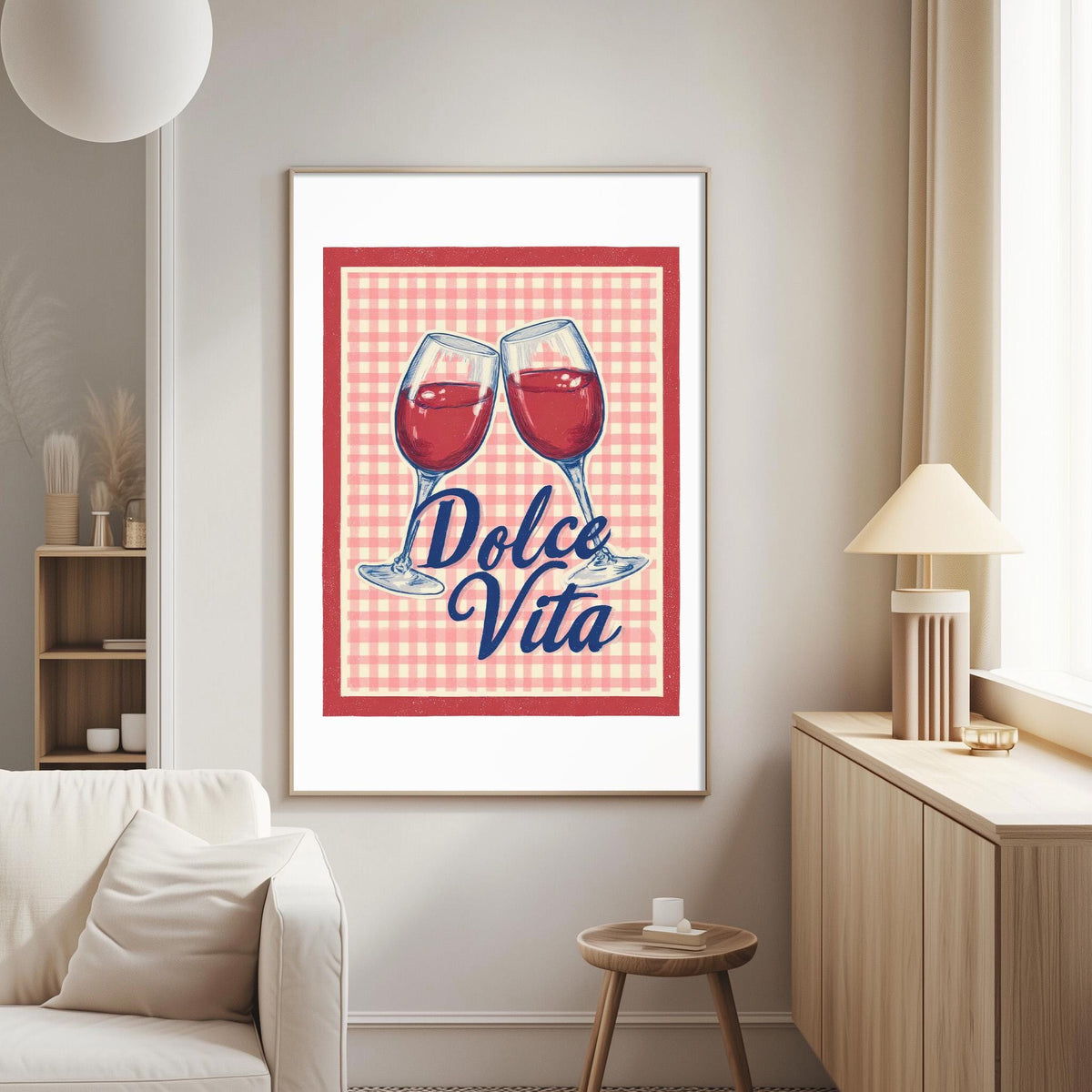 a framed poster with a red and white checkered background, depicting two wine glasses with red wine, and the text "Dolce Vita" written in a cursive font.