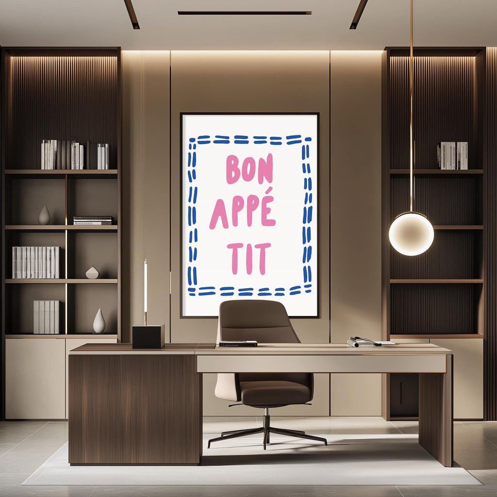 a modern office space with a desk, chair, and bookshelves. A large framed poster with the text " bon appe tit" is displayed on the wall above the desk.