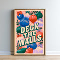 The image is a framed poster with a colorful and whimsical design featuring various objects such as balls, flowers, and leaves. The text "DEKK THE WALLS" is prominently displayed in the center of the poster, creating a playful and imaginative visual.
