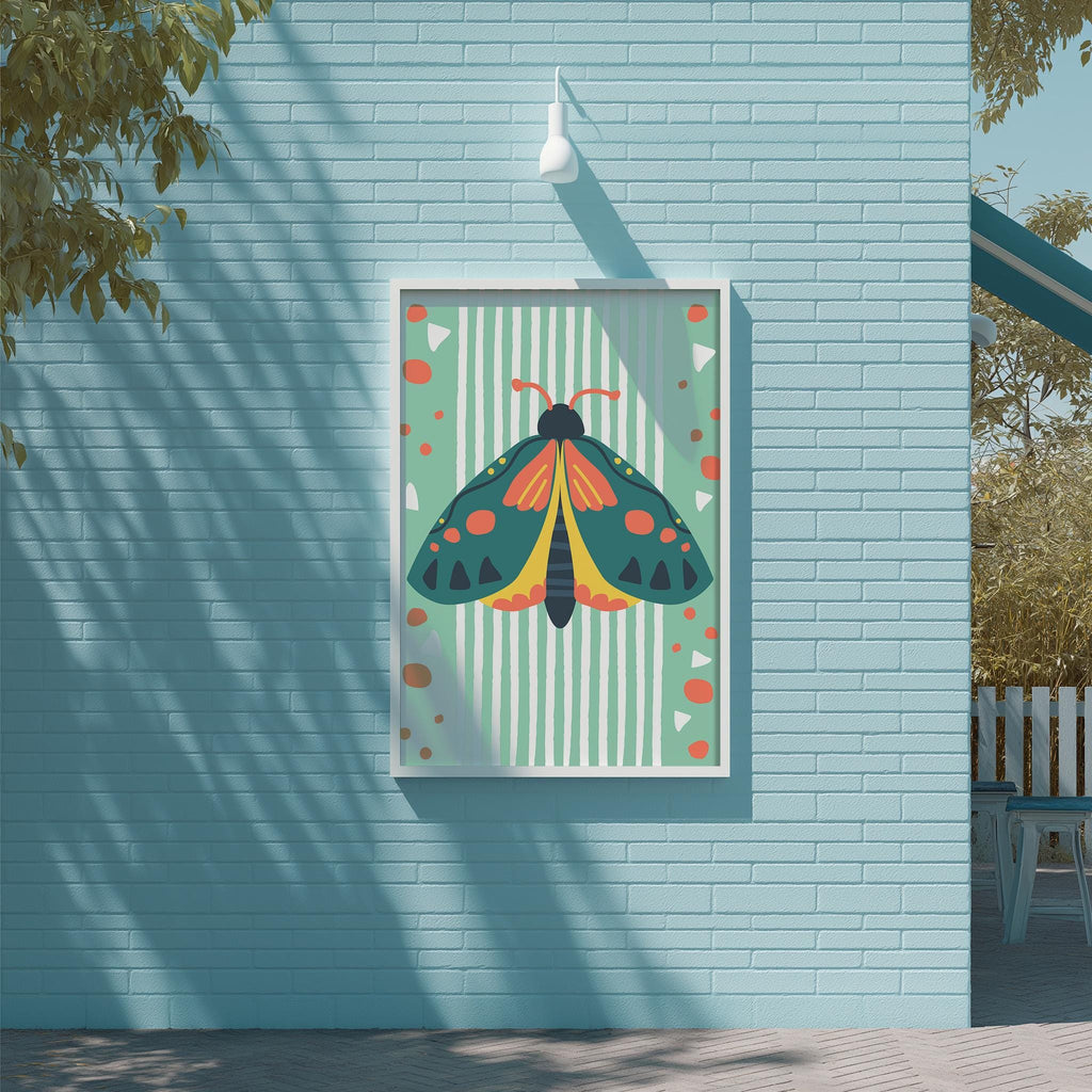 a colorful poster of a butterfly hanging on a blue wall.