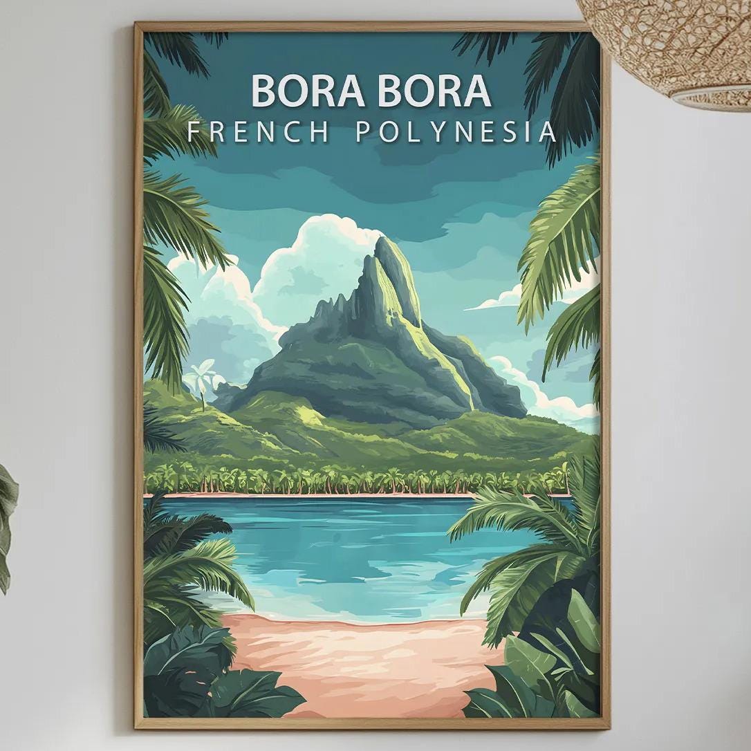 a framed poster of a tropical island landscape with palm trees, a beach, and a mountain in the background, hanging on a wall above a dining table with various items on it.