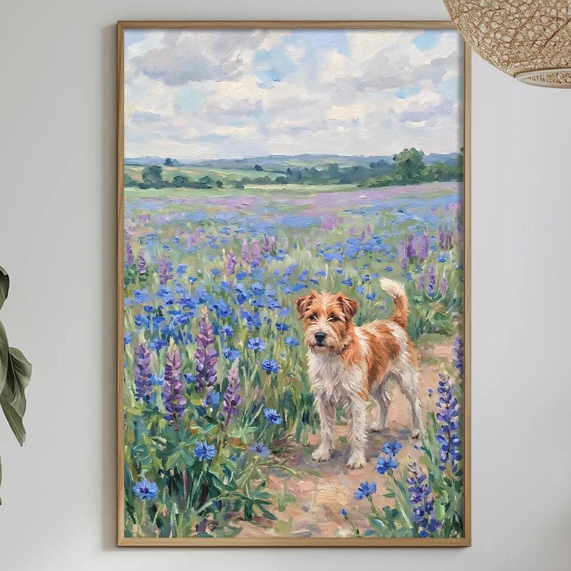 a painting of a dog in a field of flowers, hanging on a wall above a table with various items on it.