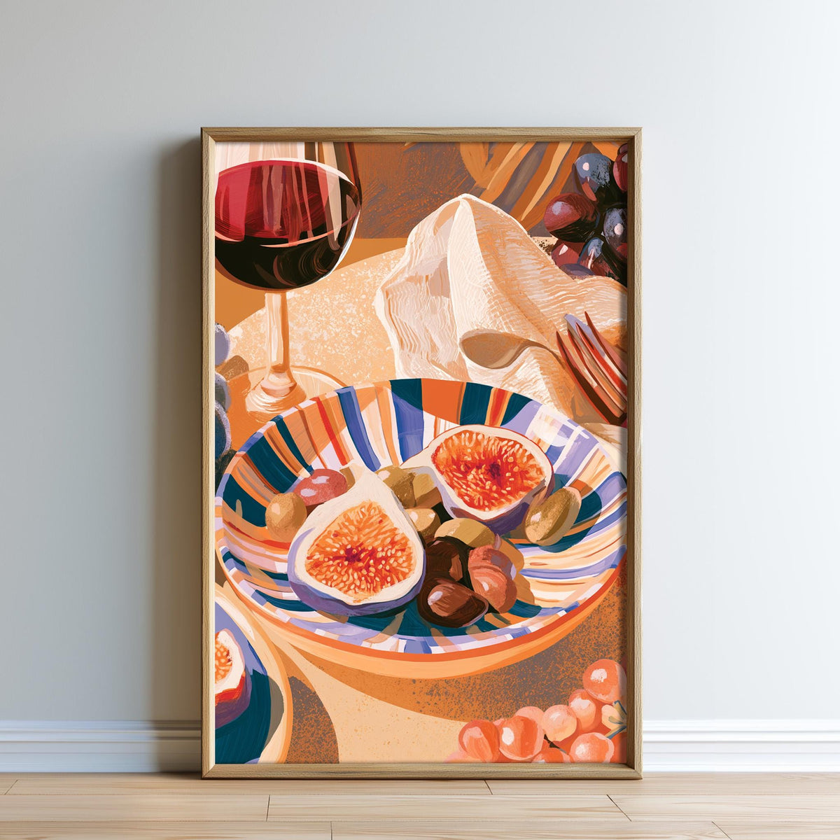 The image is a framed illustration depicting a table with a plate of fruit, including two sliced figs and a glass of red wine.