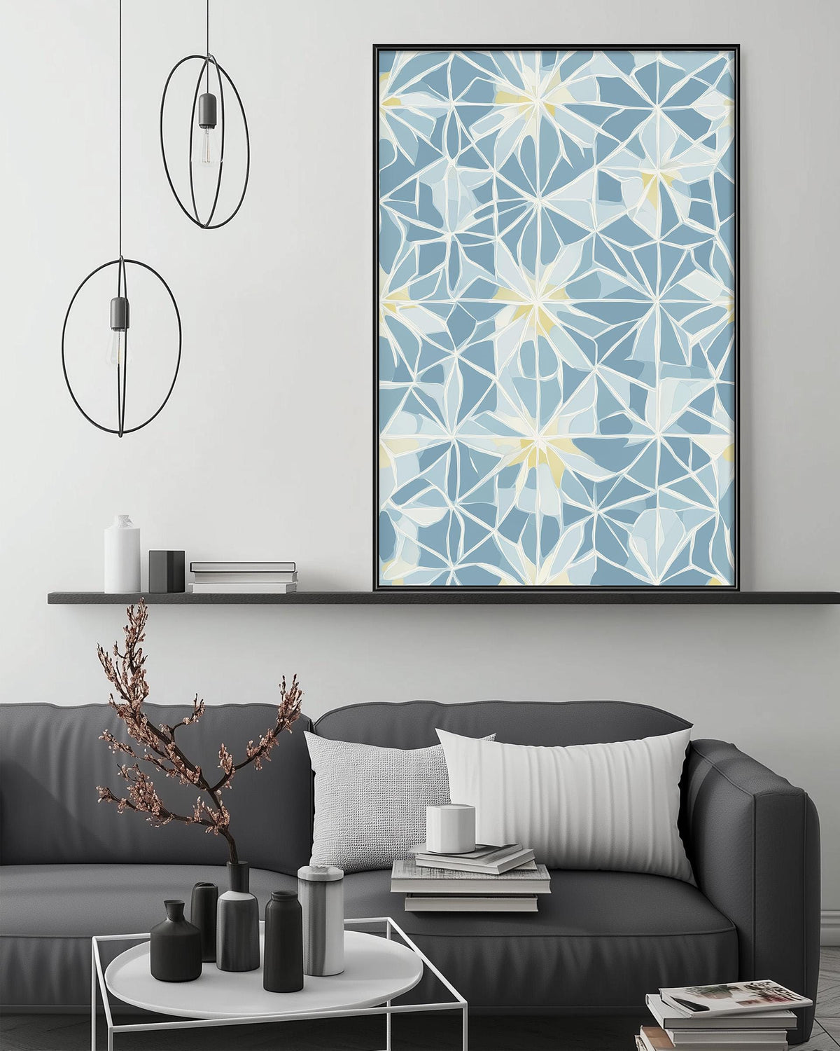 a modern living room with a gray sofa, a coffee table, and a large abstract floral pattern on the wall above the sofa.