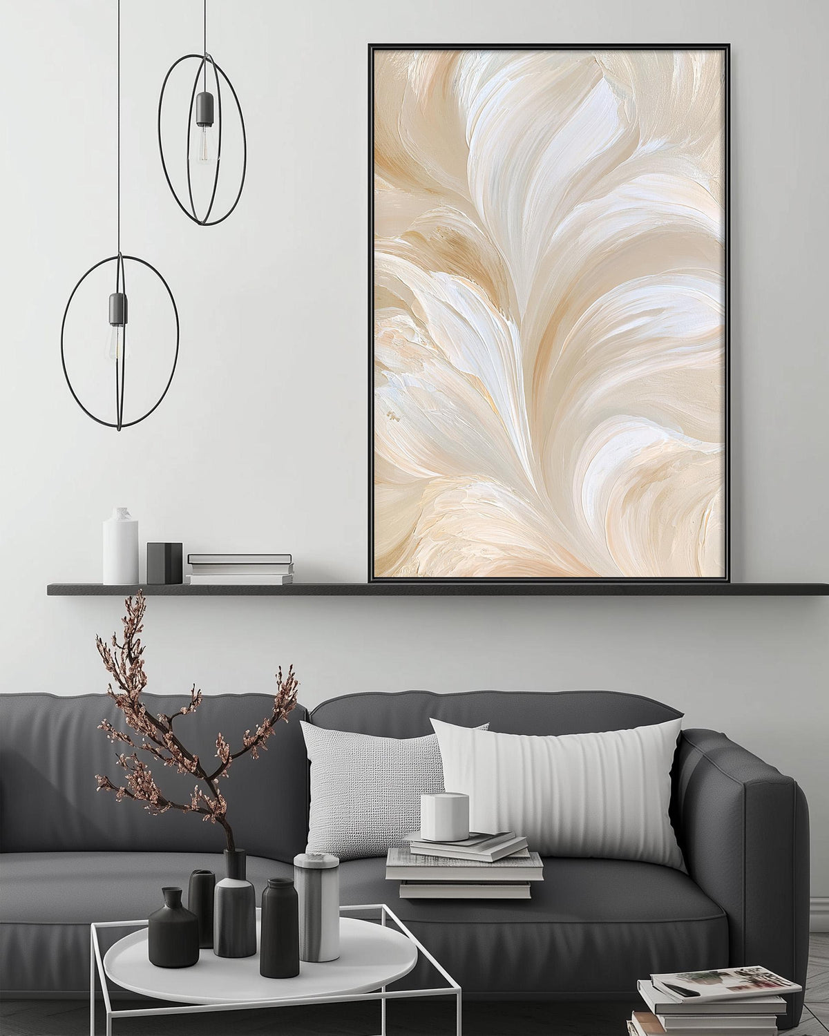 a modern living room with a gray sofa, a coffee table, and a large abstract painting on the wall above the sofa.