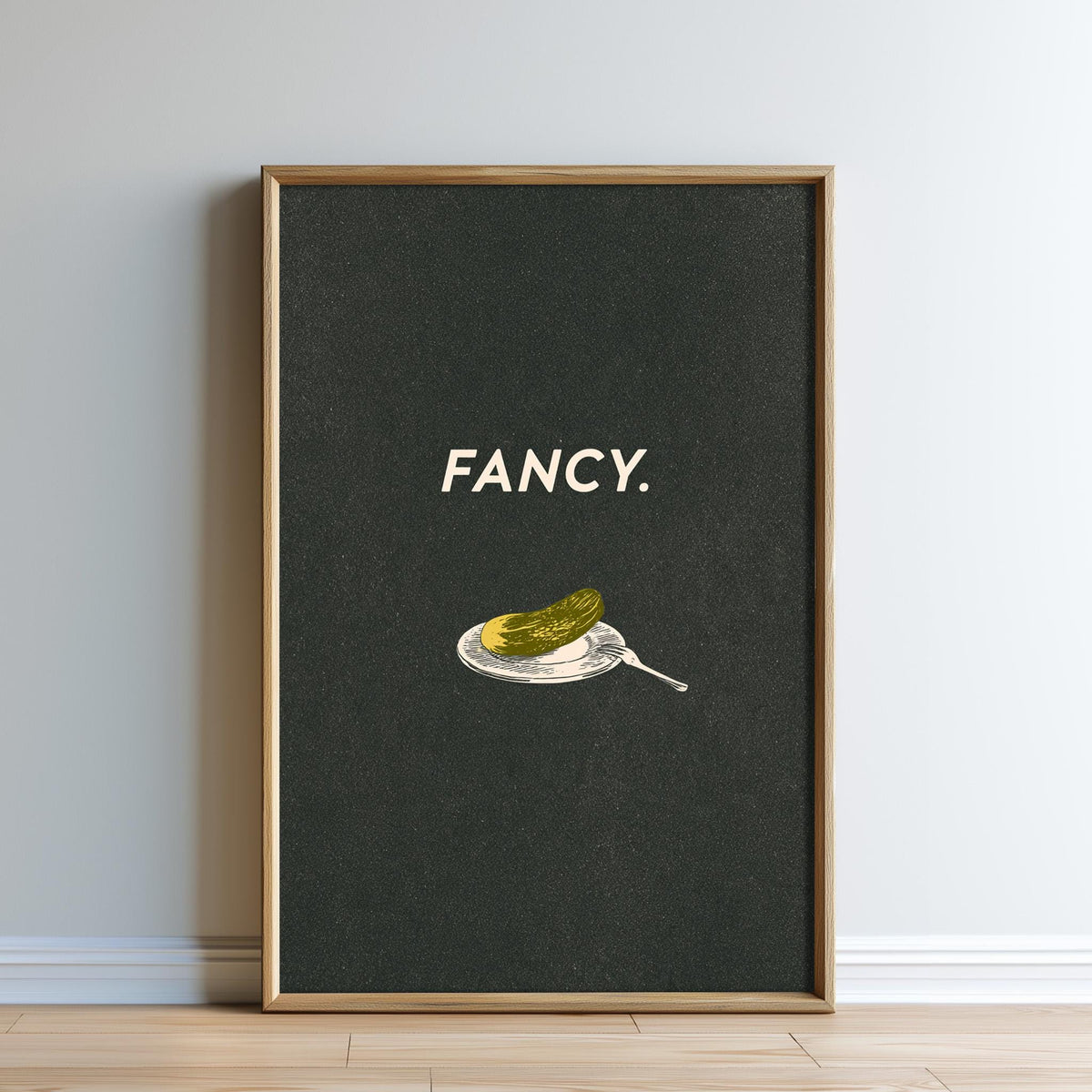 The image is a framed poster with a black background and a white text that says "FANCY."