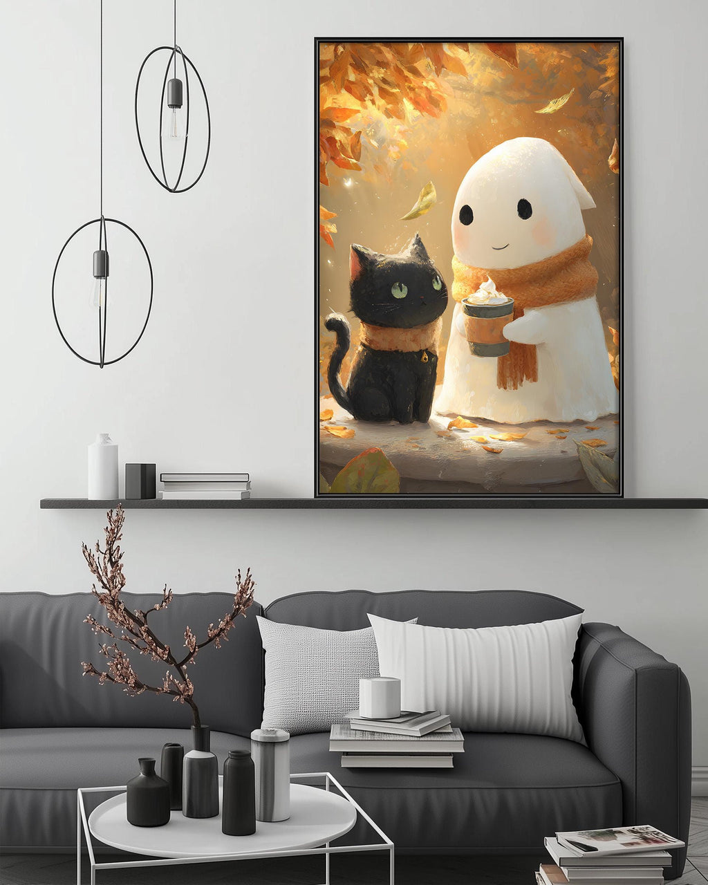 a cozy living room with a gray couch, a coffee table, and a large framed artwork depicting a black cat and a ghost in a fall scene.